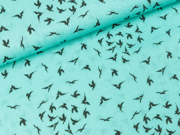 Leinendruck Delfi Schwalben auf helltürkis