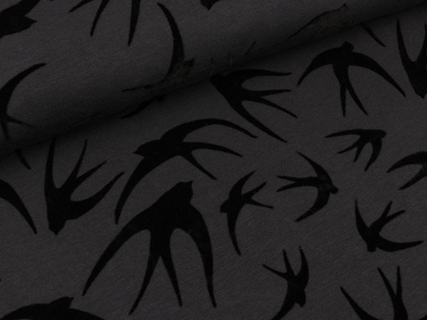 Baumwolljersey Schwalben schwarz auf Dunkelgrau Flockprint
