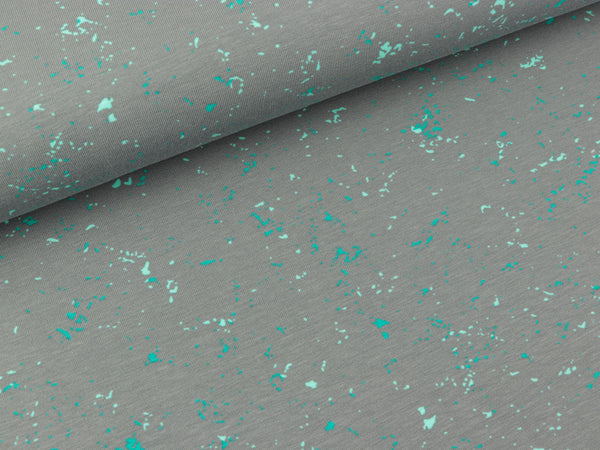 Baumwolljersey Sprenkel türkis-mint auf Grau by Petra Laitner