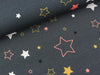 Reststück 29cm - Baumwollsweat Mira Sterne bunt auf Anthrazit