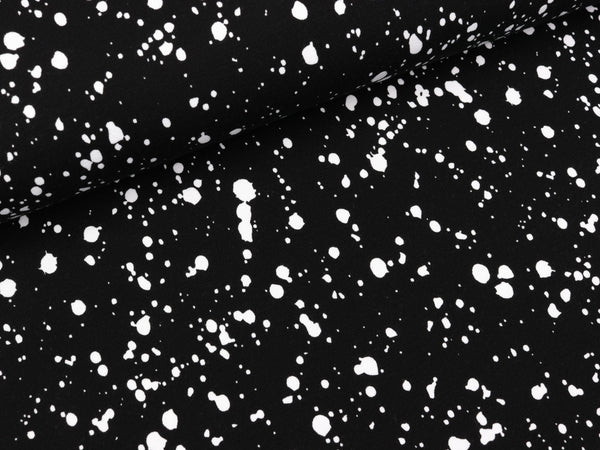 Baumwolljersey Paint Drops weiß auf Schwarz
