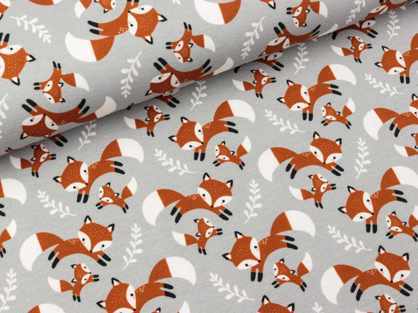 Baumwolljersey Theo Füchse und Zweige auf Hellgrau