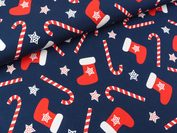 Baumwolljersey Feliz Navidad Nikolausstiefel und Zuckerstangen auf Dunkelblau