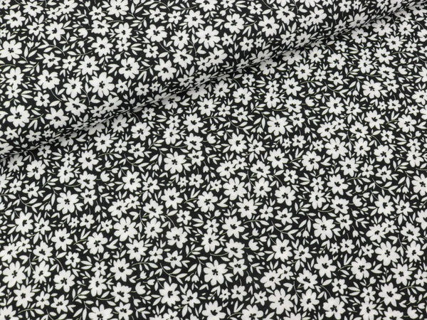 Viskosestoff Viola Streublümchen weiß auf Schwarz