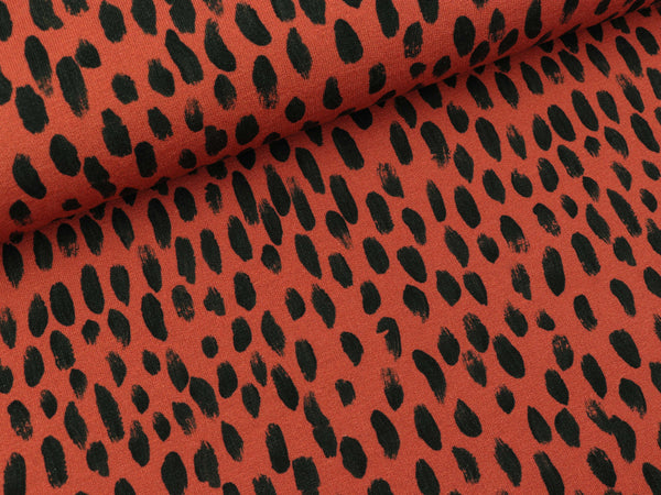 Reststück 23cm - Modalsweat Brush Tupfen schwarz auf Terracotta by Cherry Picking