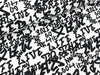 Baumwolljersey Confetti Buchstaben schwarz auf Weiß