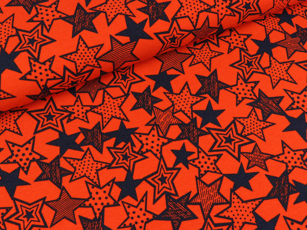 Baumwolljersey Vicente Sterne dunkelblau auf Orange