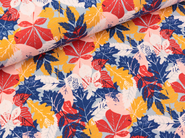 Baumwolljersey Bunte Blätter auf Hellblau