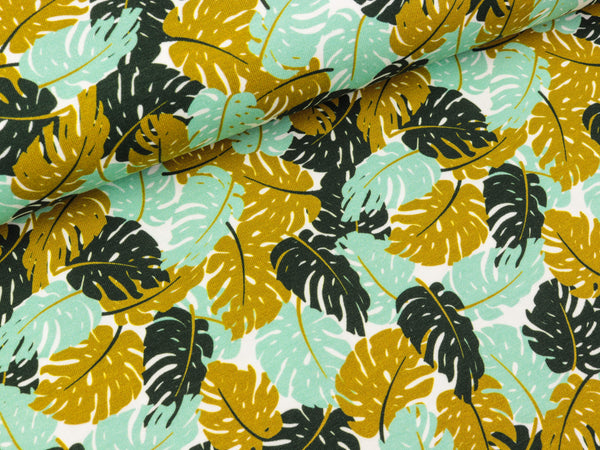 Baumwolljersey Theo Monsterablätter mint-ocker-schwarz auf Weiß