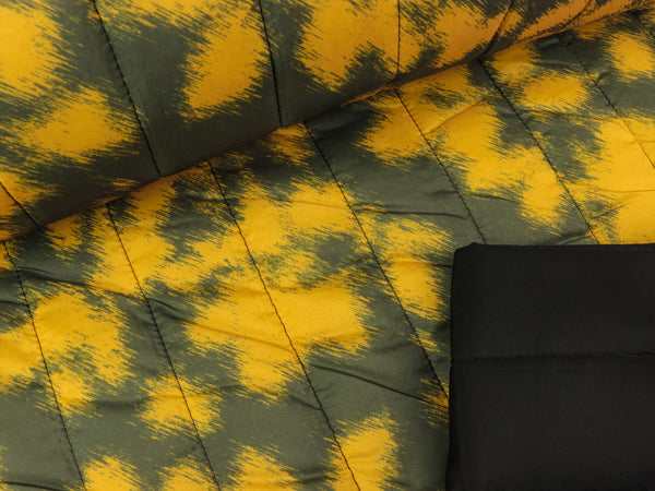Steppstoff Fleckmuster senfgelb-dunkelgrau wattiert Längssteppung