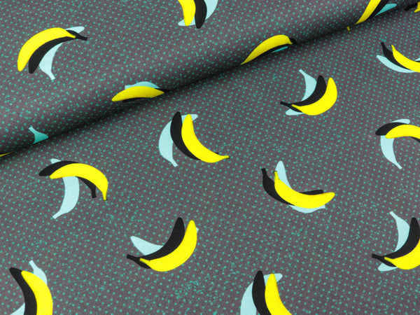 Baumwollcanvas URBANana Bananen türkis-gelb auf Dunkelgrau by Thorsten Berger
