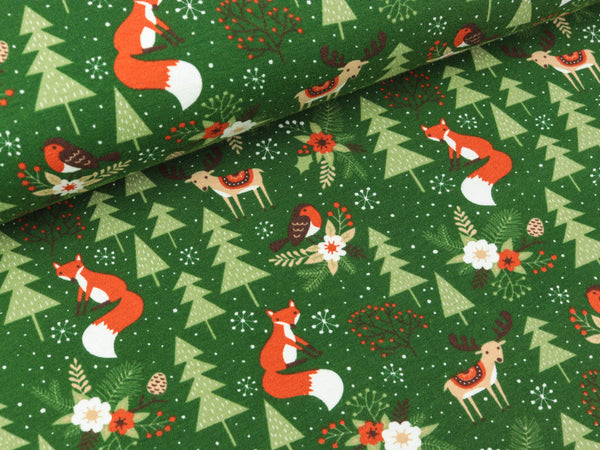 Baumwolljersey Tiere im Winterwald auf Dunkelgrün