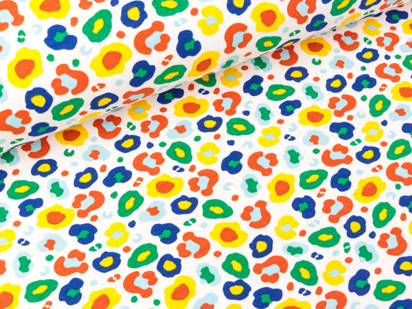 Baumwolljersey Leomuster dunkelblau-gelb-grün-bunt auf Weiß